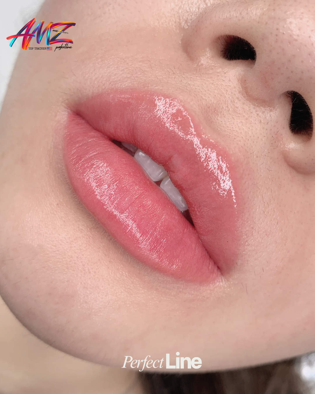 Close-up of healed lip blush in a soft muted pink, glossy and even across the full lip