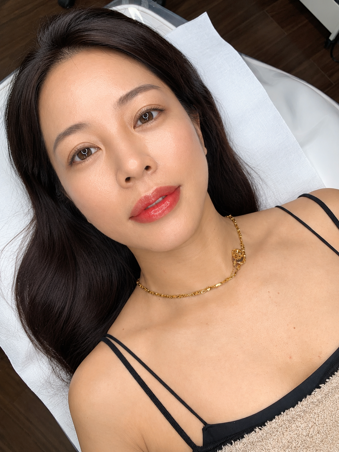 Perfect Line client resting in the studio after a lip blush appointment, lips a soft natural rose