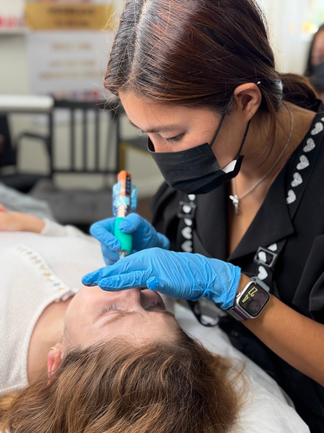 Close-up of Master PMU Artist Yu-Jin Lee performing a lip blush procedure